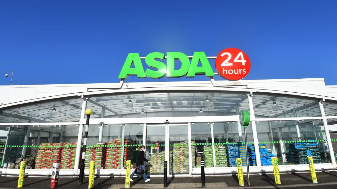 Image of a supermarket store shopfront with a deep blue sky.