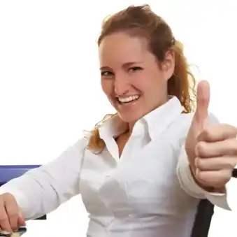 The studio image depicts a person smiling and giving a thumbs-up while the other hand rests on a desk, symbolising HR services for employees.